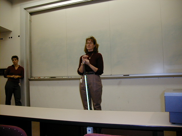 Diane demonstrates cane to the class.